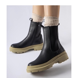 Botines negros con suela oliva. 1
