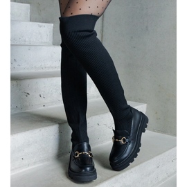 Botas negras con parte superior flexible y tacón plano. negro 1