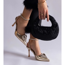 Tacones dorados con tacón abierto decorado con circonitas. 5