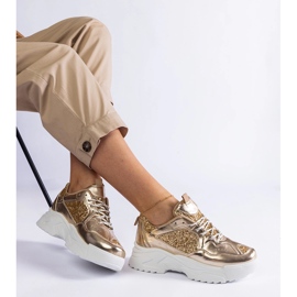 Zapatillas de mujer doradas con inserciones de purpurina. dorado 3