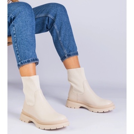 Botines beige con parte superior de tela. 1