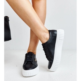 Zapatillas de deporte de cuero negro en la espesa suela atia 4
