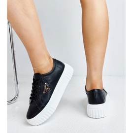 Zapatillas de deporte de cuero negro en la espesa suela atia 6