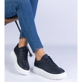 Zapatillas de zapatillas negras en una suela masiva negro 2