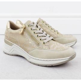 Zapatillas de deporte en una cuña rieker n4316 zlotys dorado 10