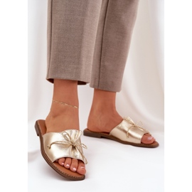 Chanclas de suela plana con un arco de oro decorativo dorado 2