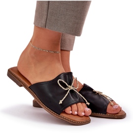 Chanclas de suela plana con un arco negro decorativo 8