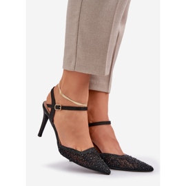 Tacones altos decorados con un tacón negro 1 Tacones altos decorados con un tacón negro 1