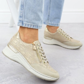 Zapatillas de deporte en una cuña rieker n4316 zlotys dorado 16