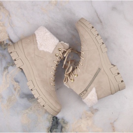 Cómodos botines de mujer beige con aislamiento de Rieker 7