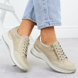 Zapatillas de deporte en una cuña rieker n4316 zlotys dorado 20
