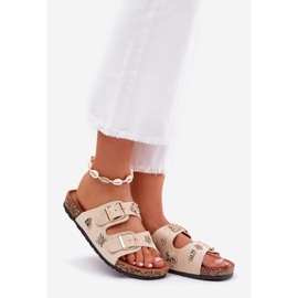 Zapatillas para mujeres en una suela de corcho con hebillas y alfileres beige 1