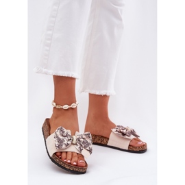Zapatillas para mujeres con un arco en una plataforma de corcho beige 2 Zapatillas para mujeres con un arco en una plataforma de corcho beige 2