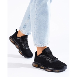 Zapatos deportivos en una plataforma de goma negro 4