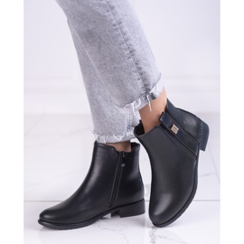 Elegantes botas Chelsea de mujer con tacón plano. negro 2