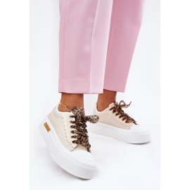 Zapatillas para mujeres en una plataforma masiva con beige decorativo de cordones 5