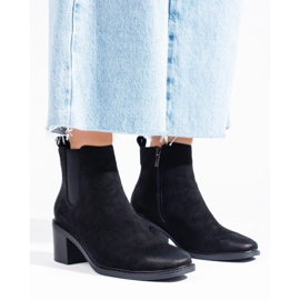 Botines Chelsea negros de mujer en el poste 4