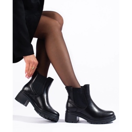 Botines Chelsea negros de mujer en el poste 4