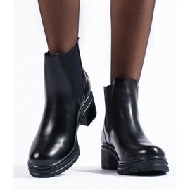 Botines Chelsea negros de mujer en el poste 1