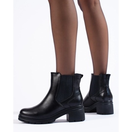 Botines Chelsea negros de mujer en el poste 3