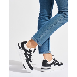 Deportivas negras y blancas con plataforma negro 1