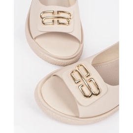 Goodin Sandalias planas beige con un adorno 4