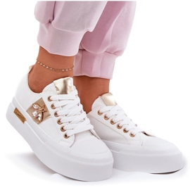 Zapatillas de deporte para mujeres en la plataforma con un detalle decorativo blanco 9
