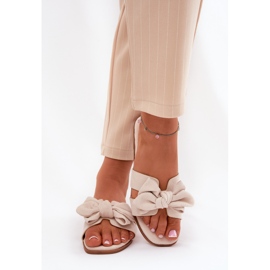 Chanclas planas para mujeres con beige de arco 3