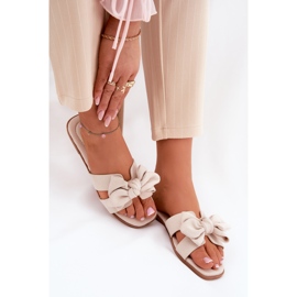 Chanclas planas para mujeres con beige de arco 8