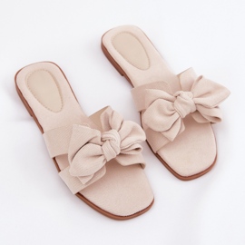 Chanclas planas para mujeres con beige de arco 9