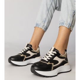 Zapatillas deportivas negras con un inserto trenzado negro 1
