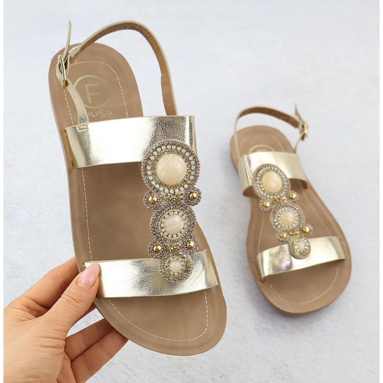 Sandalias de mujeres planas con un adorno metálico dorado Filippo DS6882 1
