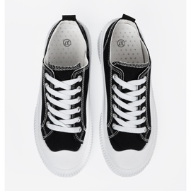 Zapatillas blancas y negras con suela gruesa. negro 3