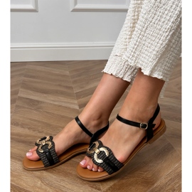 Sandalias planas negras con una decoración dorada negro 1
