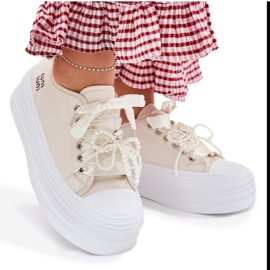 Zapatillas de deporte para mujeres en la plataforma con beige decorativo de cordones 8