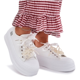 Zapatillas para mujeres en la plataforma con cordones decorativos blancos 9