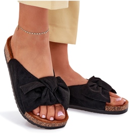Zapatillas para mujeres en una suela de corcho con un arco negro 11
