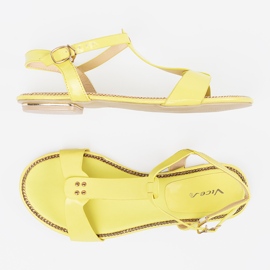 Sandalias amarillas en una suela plana amarillo 4