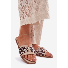 Chanclas de mujer plana con un beige de arco 1