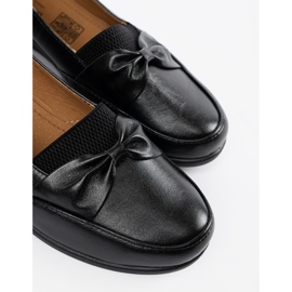 Zapatos corredizos negros con arco 5