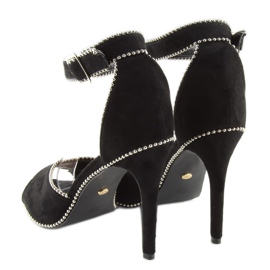 Elegantes sandalias negras sobre un tacón negro 3