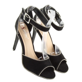 Elegantes sandalias negras sobre un tacón negro 6