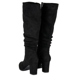 Botas clásicas de mujer. negro 4