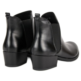 Corina Botines Chelsea negros con tacones altos 5