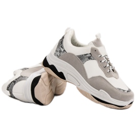 Zapatillas blancas con estampado negro marrón 1 Zapatillas blancas con estampado negro marrón 1