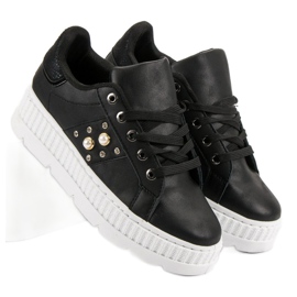 Zapatos negros en la plataforma 4