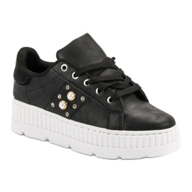 Zapatos negros en la plataforma 5
