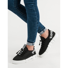 Zapatos deportivos con amor de puño negro 6