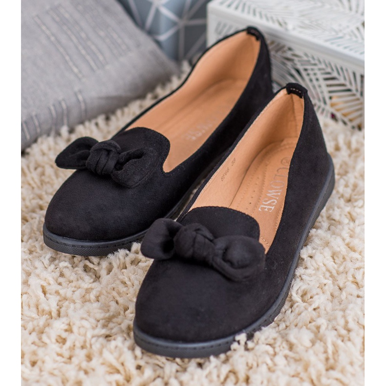 Clowse Señores con un arco negro 2