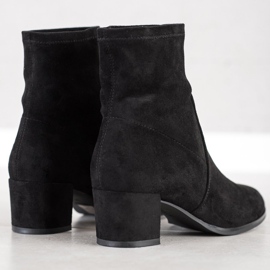 Sergio Leone Botas elegantes en un poste negro 2